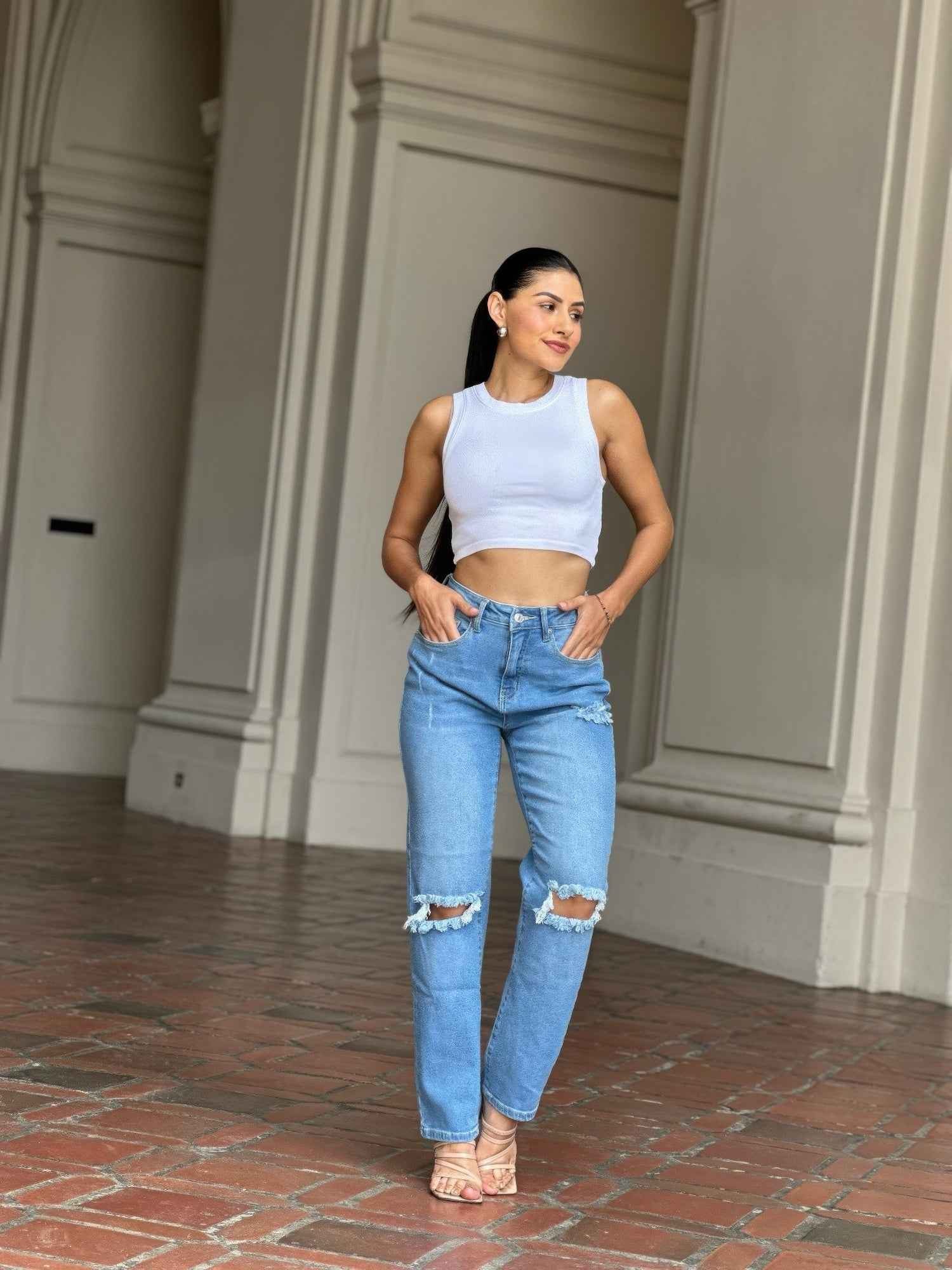 Medium Wash High Rise Jeans With Distress And Rips